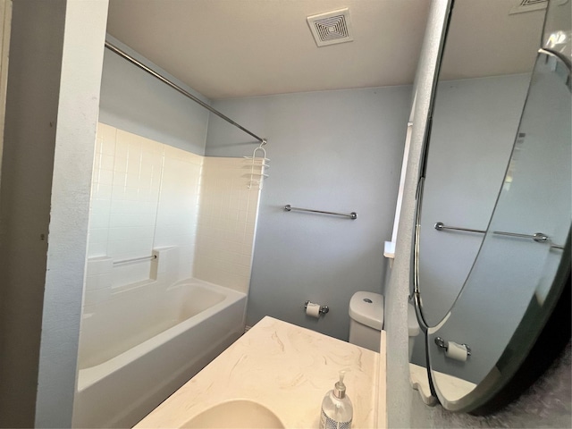 bathroom with shower / bathtub combination and toilet