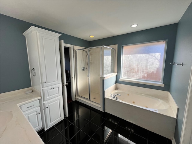 bathroom featuring tile patterned flooring, vanity, and plus walk in shower