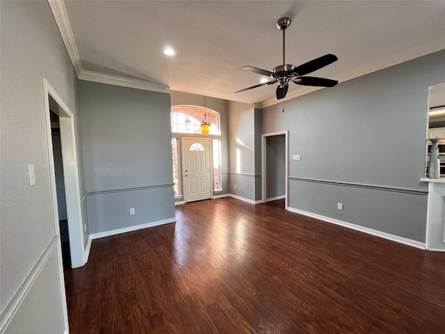 interior space with crown molding, dark wood-type flooring, and ceiling fan