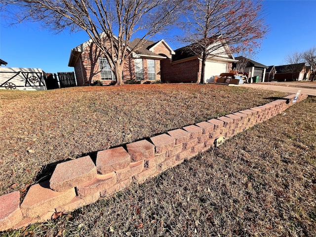 view of front of property with a garage and a front yard