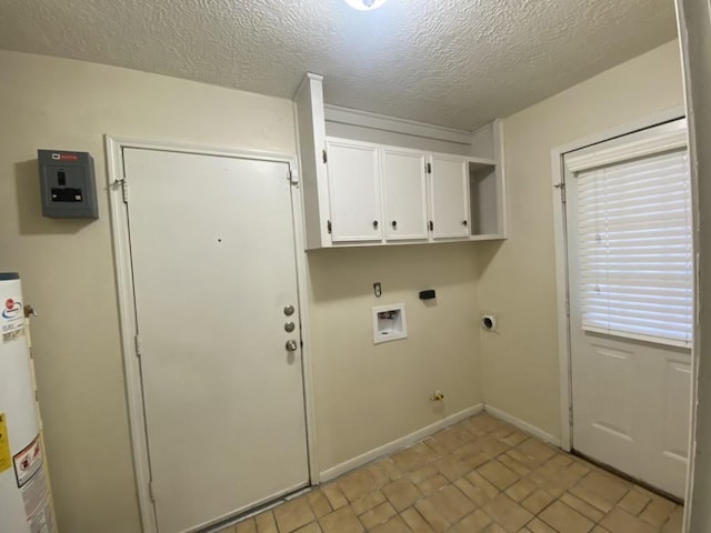 washroom with washer hookup, cabinets, hookup for an electric dryer, gas dryer hookup, and a textured ceiling