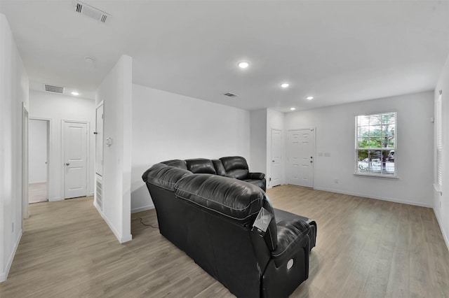 living room with light hardwood / wood-style flooring