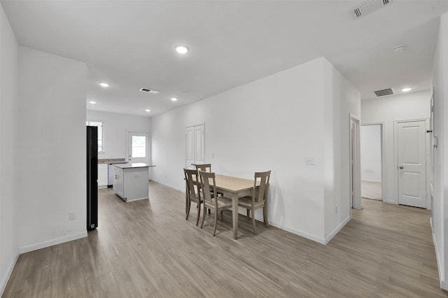 dining area featuring light hardwood / wood-style floors