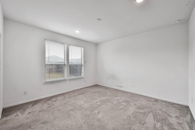 empty room featuring carpet flooring