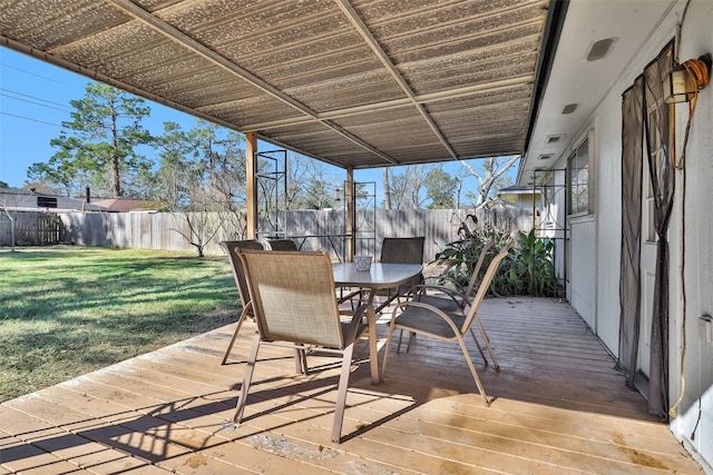 wooden deck featuring a yard