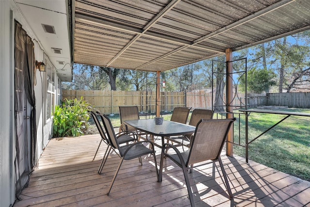 wooden deck featuring a yard