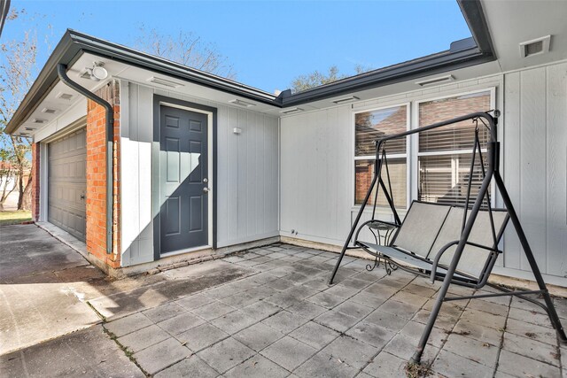 property entrance featuring a garage