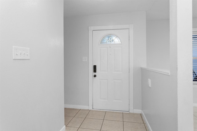 foyer entrance featuring light tile patterned floors