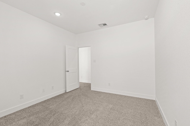 empty room with carpet flooring