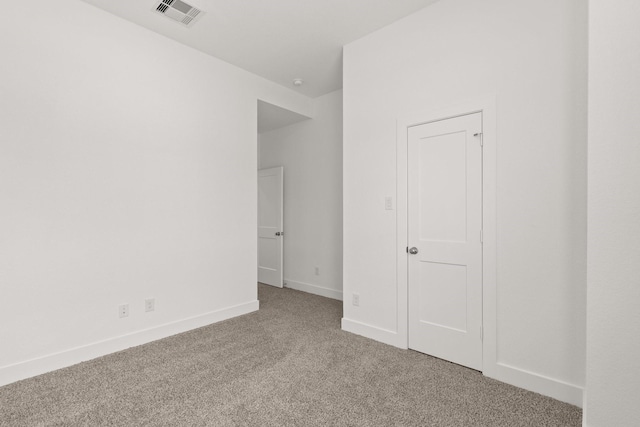 unfurnished bedroom with light colored carpet