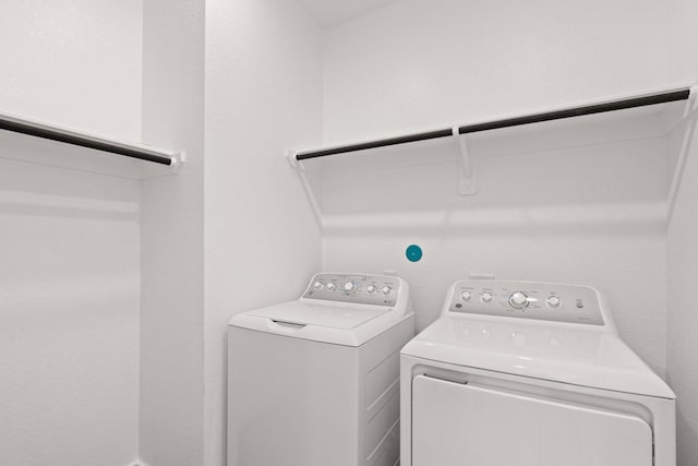 laundry room with washing machine and clothes dryer