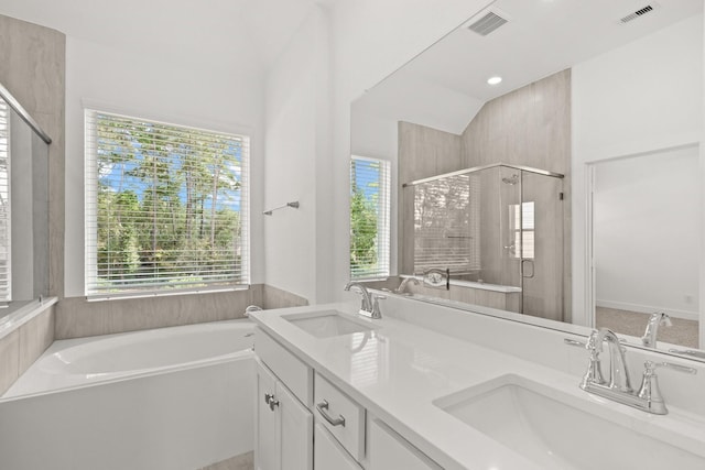 bathroom featuring vanity and separate shower and tub