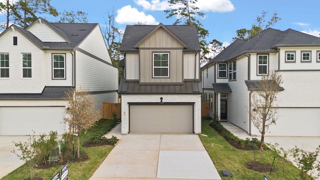 view of front facade with a front lawn and a garage