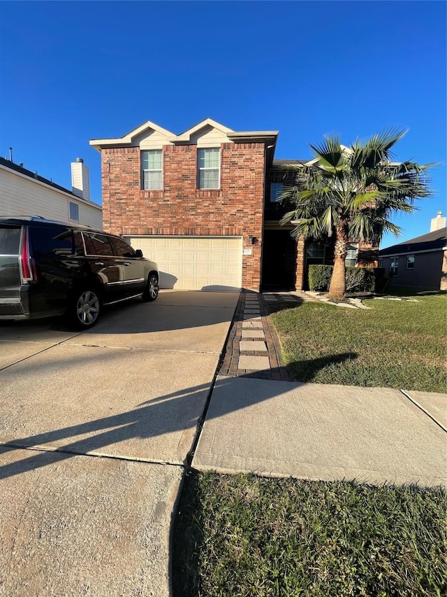 view of front of house with a garage, brick siding, concrete driveway, and a front yard