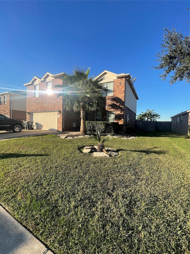 view of front of home featuring a front lawn and a garage