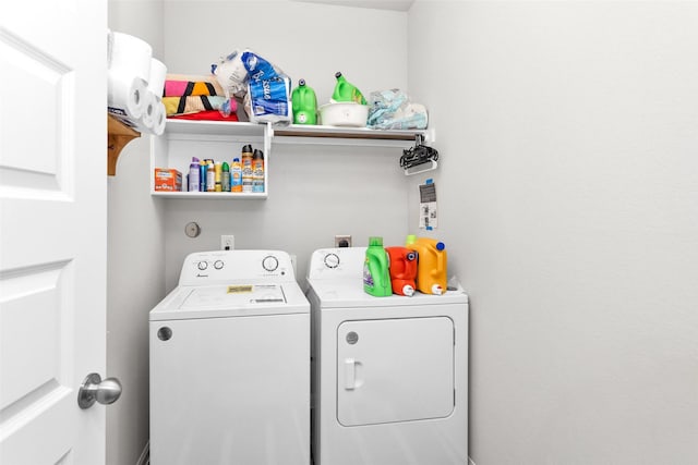 laundry room featuring washer and clothes dryer