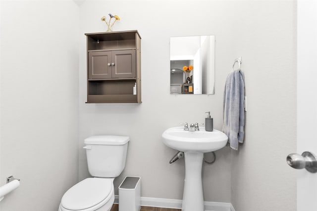 bathroom featuring toilet