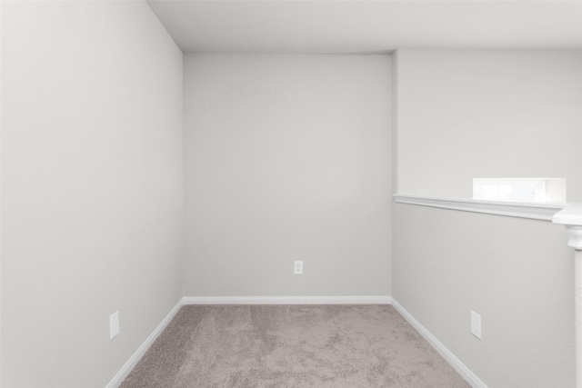 empty room featuring light colored carpet