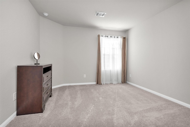 unfurnished bedroom with light colored carpet