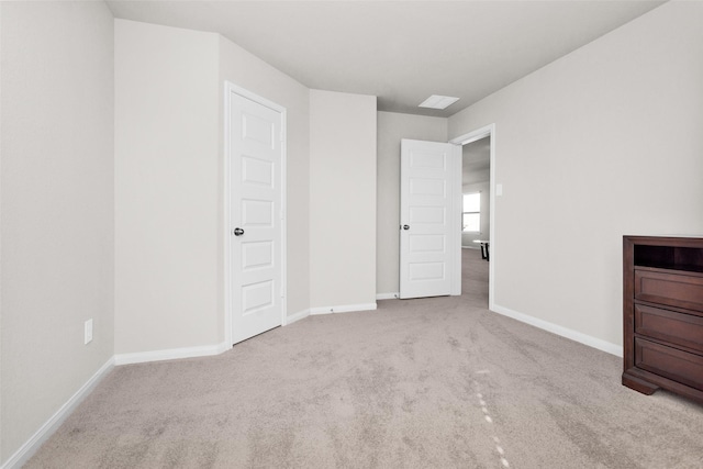 unfurnished bedroom with light colored carpet