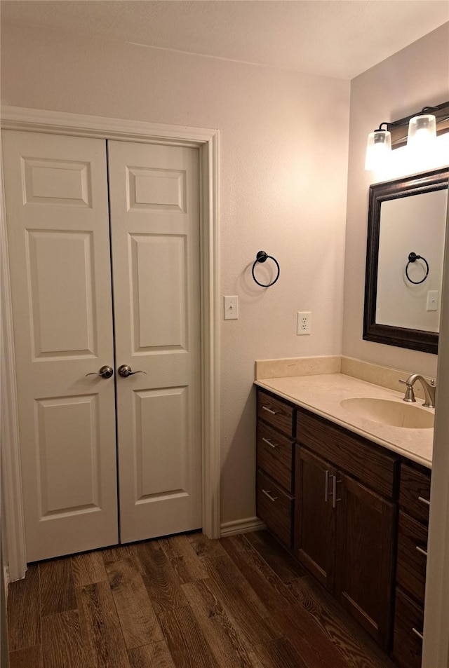 bathroom with vanity and hardwood / wood-style flooring