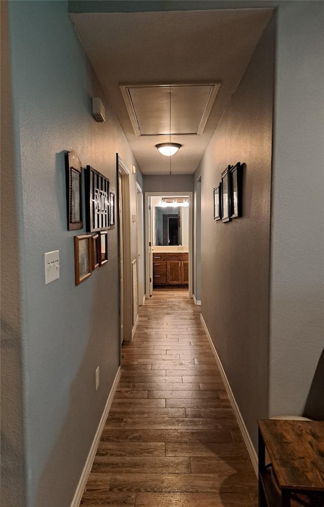 hall with hardwood / wood-style floors