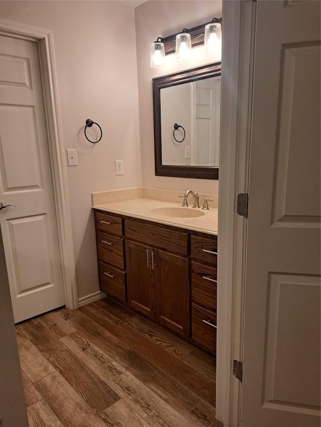 bathroom featuring wood-type flooring and vanity