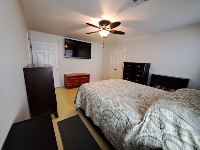 bedroom featuring ceiling fan and a closet