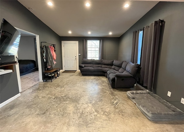 living room featuring vaulted ceiling