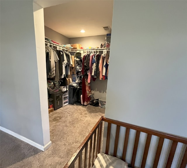 spacious closet with carpet floors