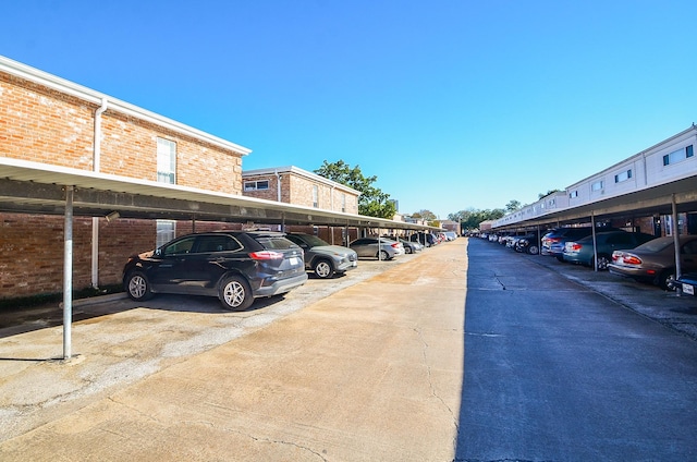 view of parking / parking lot with a carport