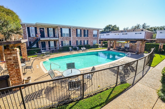 view of swimming pool with a patio area