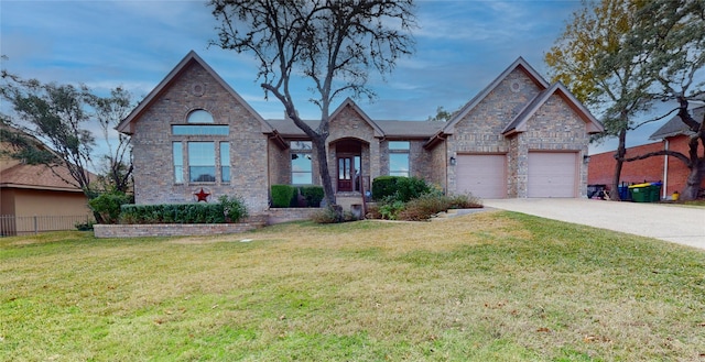 view of front facade with a garage and a front yard