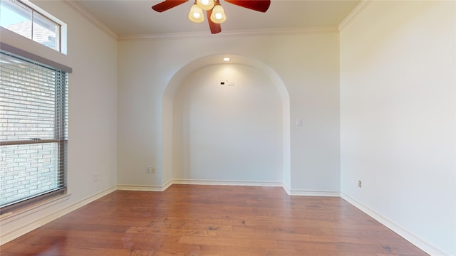 unfurnished room with wood-type flooring, ceiling fan, and crown molding