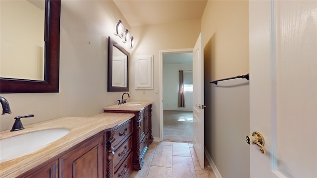 bathroom featuring tile patterned flooring and vanity