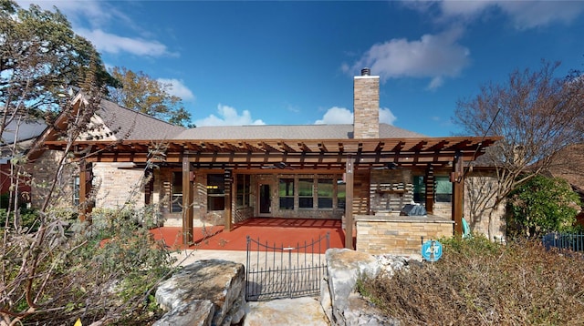 back of house with a patio area and ceiling fan