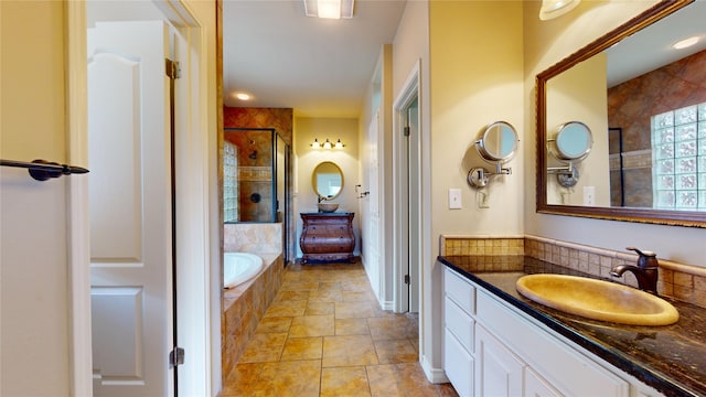 bathroom with separate shower and tub and vanity