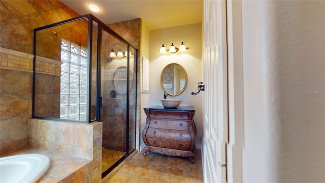 bathroom featuring plus walk in shower and sink