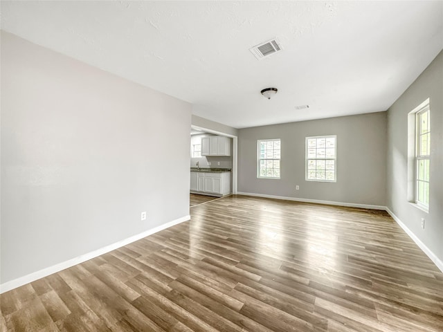 unfurnished room with light hardwood / wood-style flooring