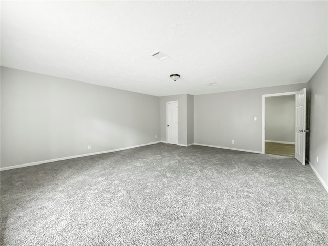 unfurnished room with carpet floors