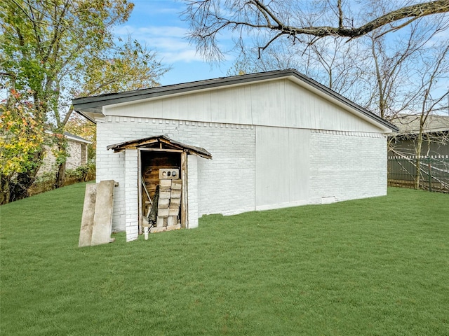 view of outdoor structure with a lawn