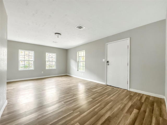 spare room featuring hardwood / wood-style flooring