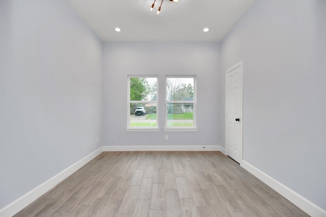 unfurnished room featuring light hardwood / wood-style floors