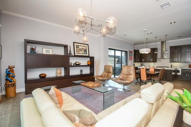 living room with light hardwood / wood-style floors and ornamental molding