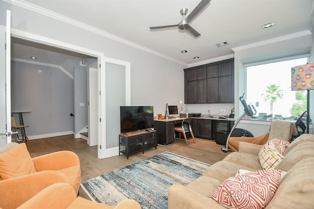 living room featuring light wood-type flooring, ceiling fan, and ornamental molding