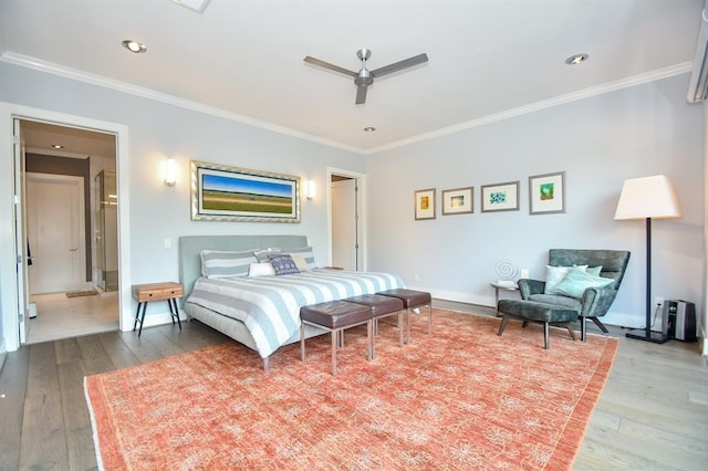 bedroom featuring ceiling fan, wood-type flooring, and crown molding