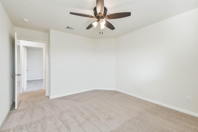 empty room with light carpet and ceiling fan