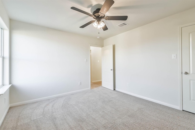 carpeted empty room with ceiling fan