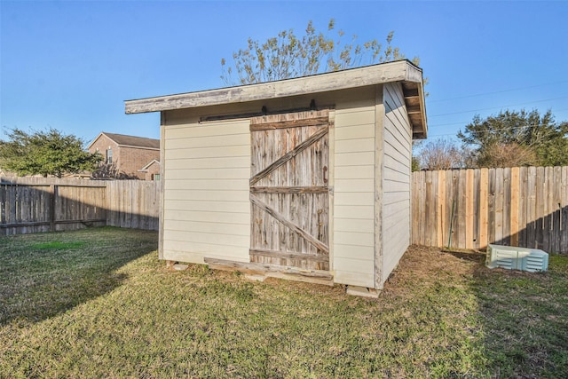 view of outbuilding featuring a yard