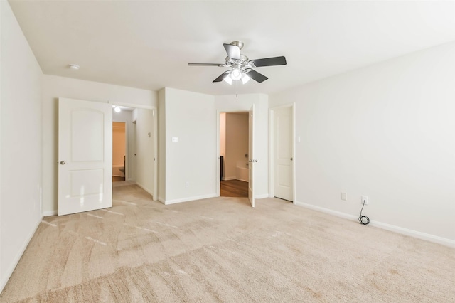 interior space with light colored carpet and ceiling fan